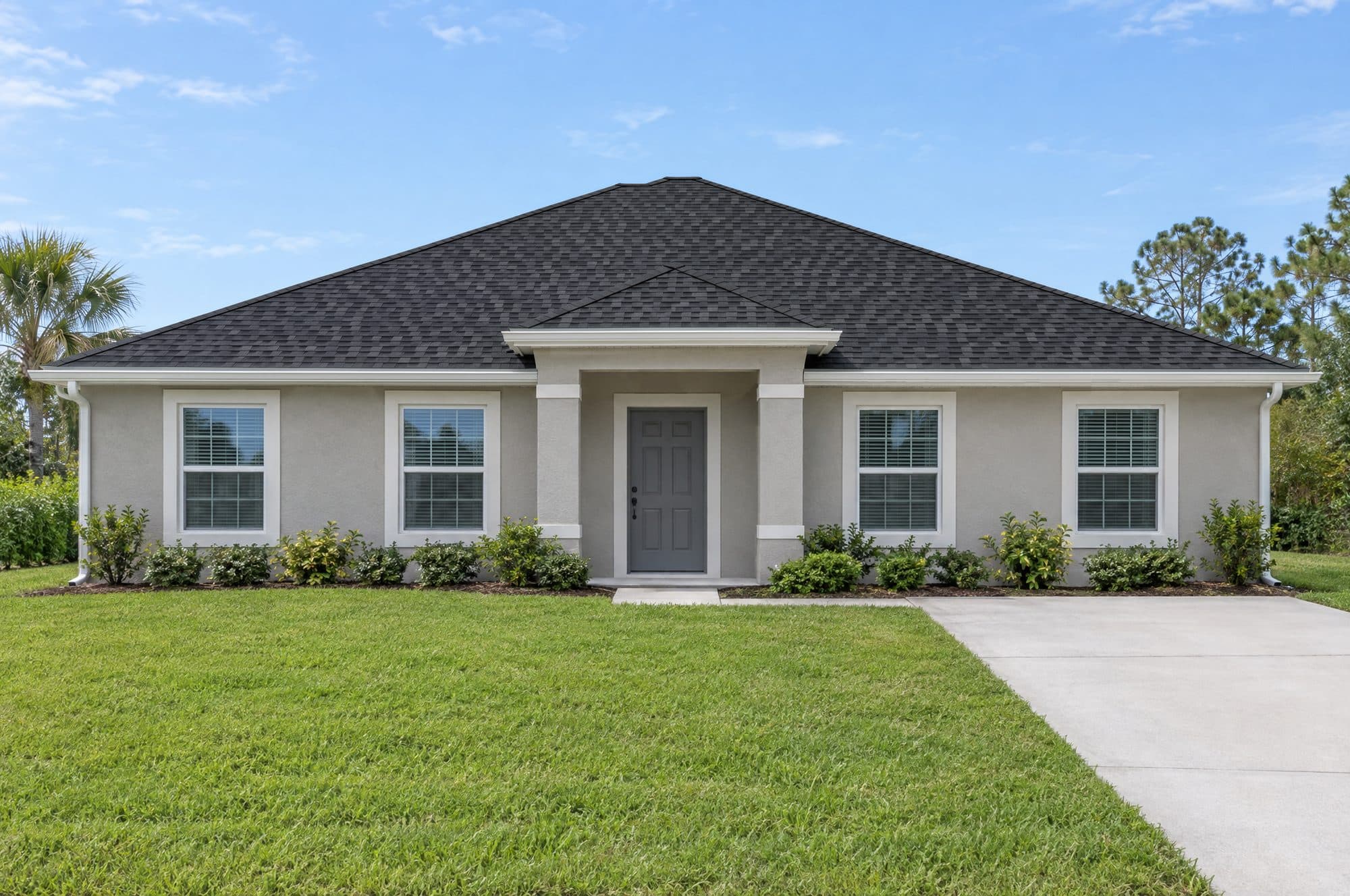 The sample home with a new Charcoal architectural shingle roof (illustration)